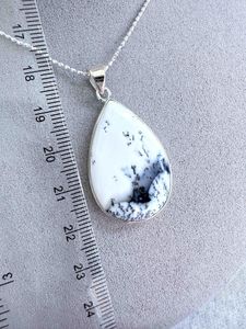 merlinite crystal pendant with optional sterling silver 18inch chain on display