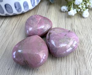 Pink rhodonite crystal puff hearts from the holistic hamper crystals UK