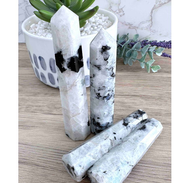 four rainbow moonstone crystal towers black and white with rainbow flash