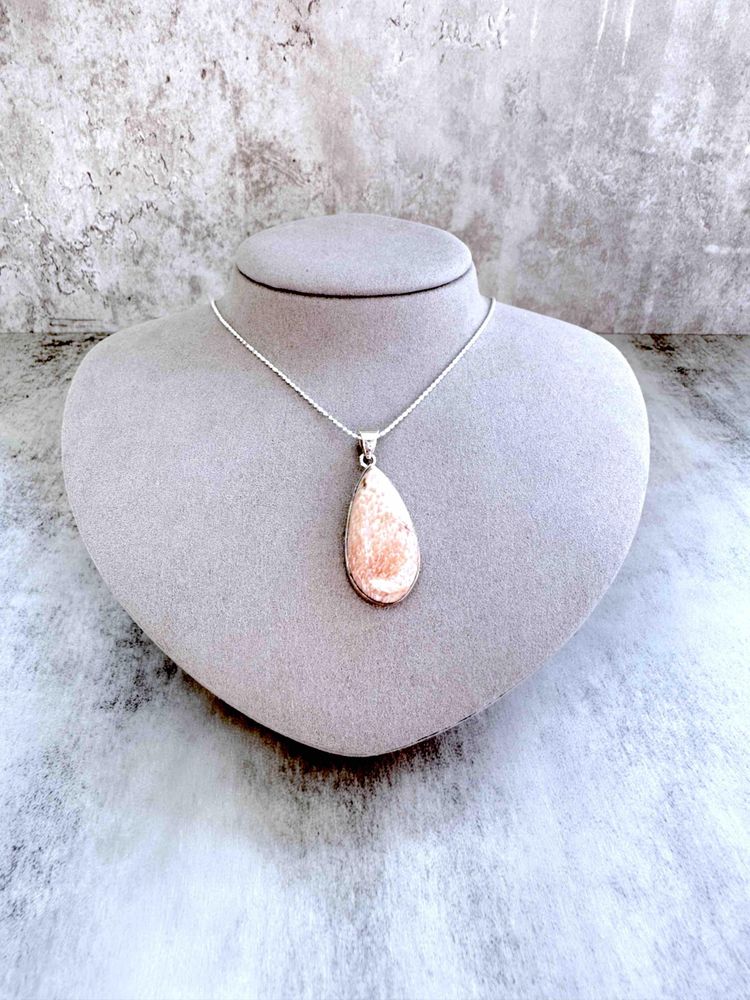 sterling silver scolocite crystal pendant with optional chain on display