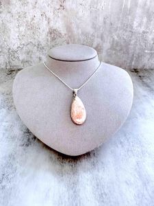 sterling silver scolocite crystal pendant with optional chain on display