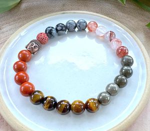 Red Mens Crystal Power Bracelet on a dish