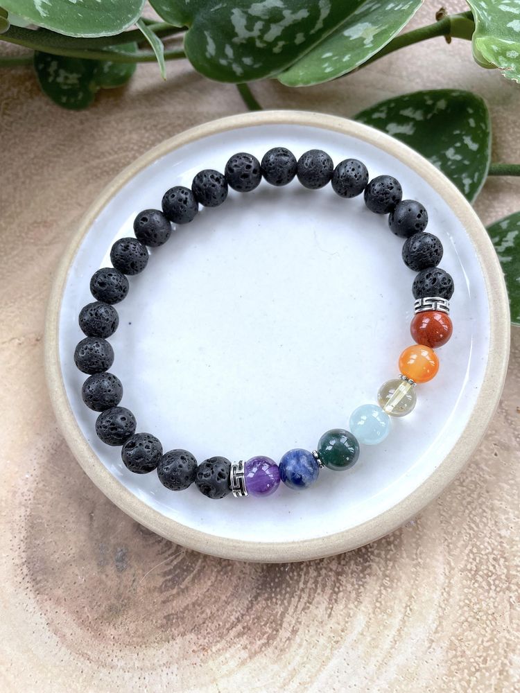 7 Chakra Balancing Crystal Gemstone Bracelet on a dish with diffuser lava beads