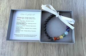 7 Chakra Balancing Crystal Gemstone Bracelet in grey Branded box with diffuser lava beads