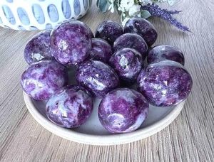 lepidolite dark purple tumble stones on a dish from the holistic hamper UK crystal shop