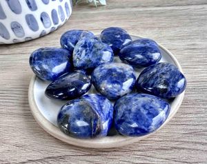Blue Sodalite crystal hearts 3cm on a dish for intuition and communication