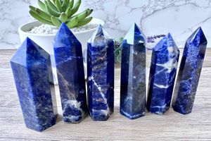 six Sodalite crystal towers blue with white and orange graining