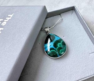 teardrop shape mallacolla sterling silver pendant on a chain in a presentation box