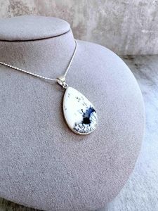 merlinite crystal pendant with optional sterling silver 18inch chain on display with ruler to show size