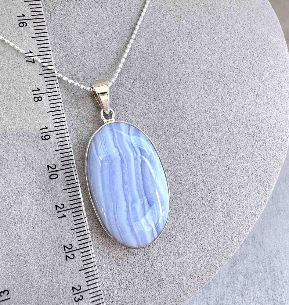 oval blue lace agate crystal pendant on chain with ruler to show sizing