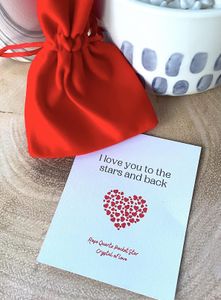 Rose Quartz star with a velvet red bag and a card saying I love you to the stars and back