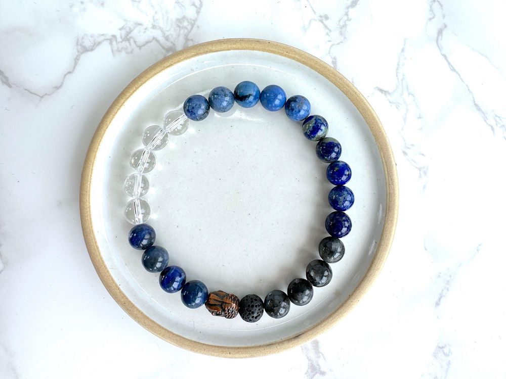 Mens blue mental well-being crystal power bracelet on stretch cord with bronze buddha head