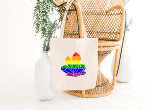 Pride lgbtq tote bag in natural hanging on a chair, Crystal tote bags from the holistic hamper