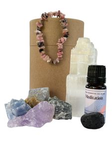 inner peace and relaxation pamper pot with a selenite tower, rhodonite bracelet, four rough crystals, essential oil blend and a lava tumble