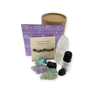 holistic pamper pots for wellbeing with heart chakra essential oil blend, selenite tower, smokey quartz bracelet, four rough crystals and lava tumble