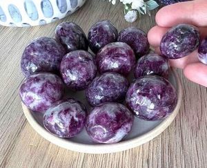 lepidolite dark purple tumble stones on a dish