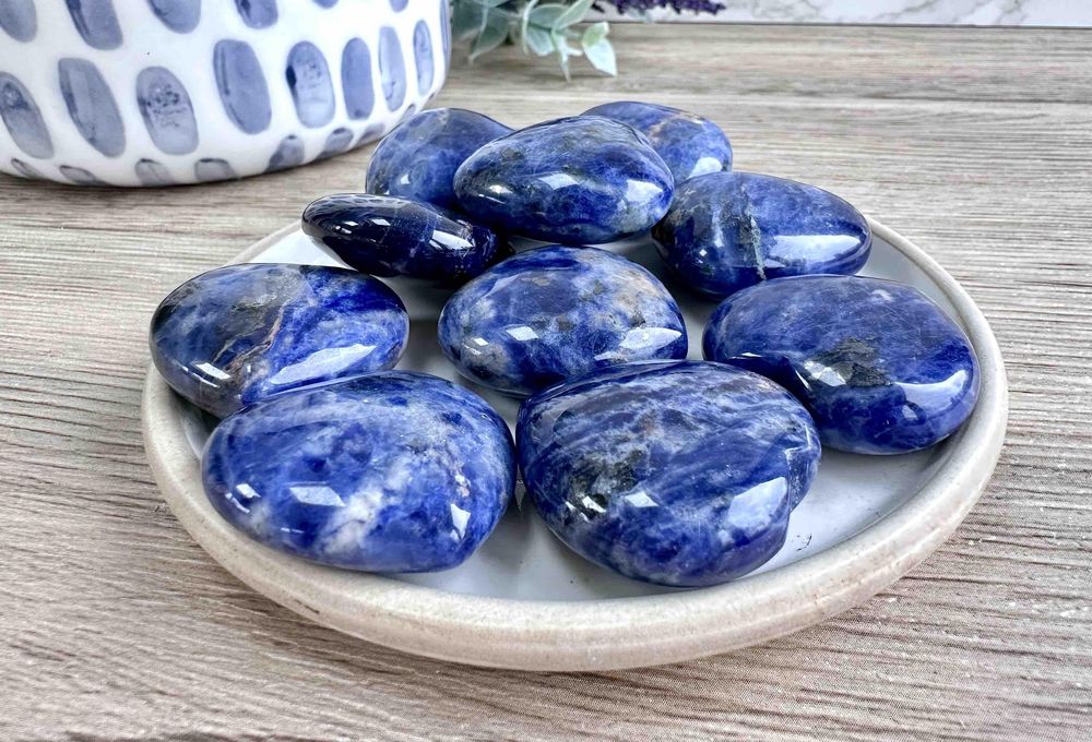 Blue Sodalite crystal hearts 3cm on a dish for intuition and communication