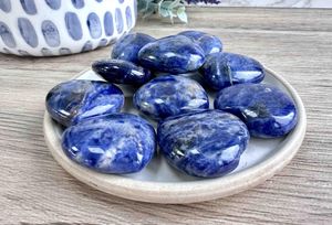 Blue Sodalite crystal hearts 3cm on a dish for intuition and communication