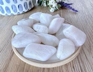 high quality white rainbow moonstone tumbles on a dish
