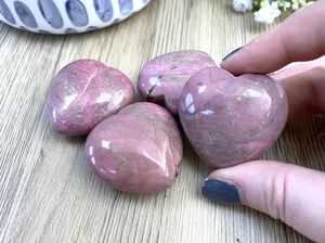 Pink rhodonite crystal puff hearts from the holistic hamper crystals UK