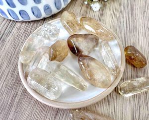 natural real citrine tumble stones on a dish