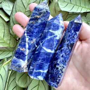 six Sodalite crystal towers blue with white and orange graining