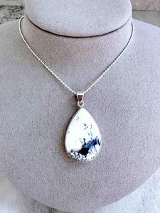 merlinite crystal pendant with optional sterling silver 18inch chain on display