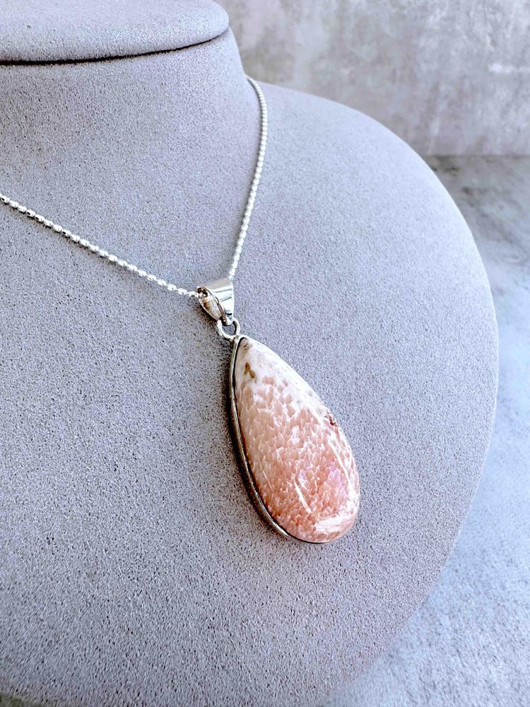 sterling silver scolocite crystal pendant with optional chain on display