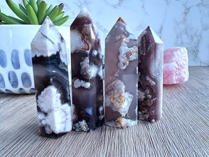 black flower agate crystal towers in a row