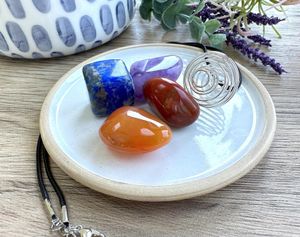Personal Power crystal cage pendant set with four tumbled stones by the holistic hamper