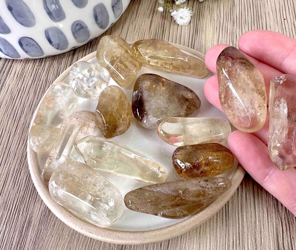 natural real citrine tumble stones on a dish