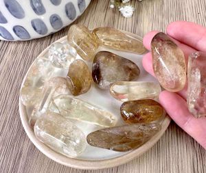 natural real citrine tumble stones on a dish