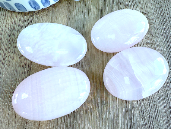 four genuine pink Mangano calcite quality palm stones