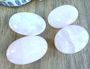 four genuine pink Mangano calcite quality palm stones