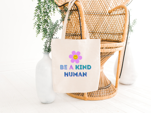 be a kind human tote bag hanging a a chair