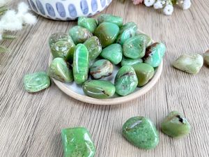 green chrysoprase crystal tumble stones on a dish