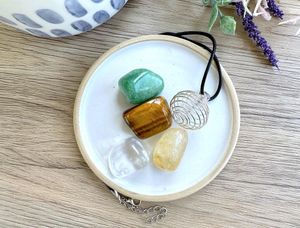 Manifestation crystal cage necklace set with four tumble stones from the holistic hamper crystal shop