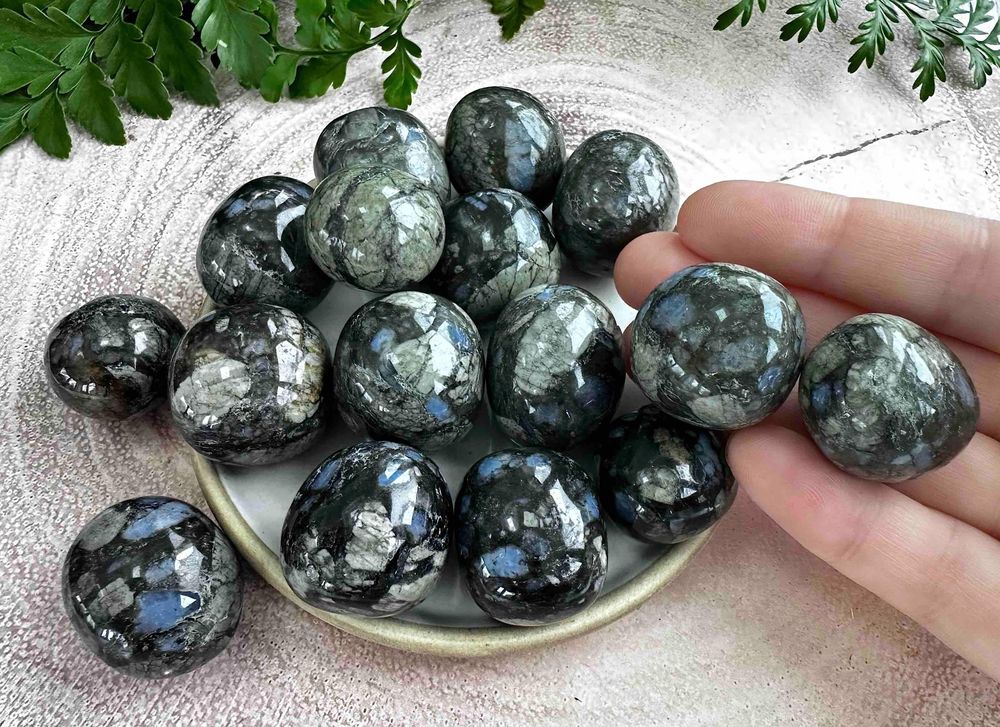 que sera or llanite crystal tumbled stones on a dish