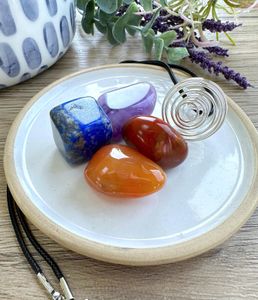 Personal Power crystal cage pendant set with four tumbled stones by the holistic hamper