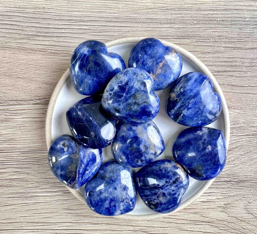 Blue Sodalite crystal hearts 3cm on a dish for intuition and communication
