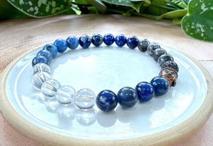 Mens blue mental well-being crystal power bracelet on stretch cord with bronze buddha head