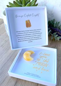 yellow calcite crystal moon in a gift box with the quote I love you to the moon and back within