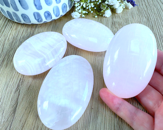four genuine pink Mangano calcite quality palm stones