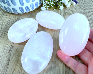 four genuine pink Mangano calcite quality palm stones