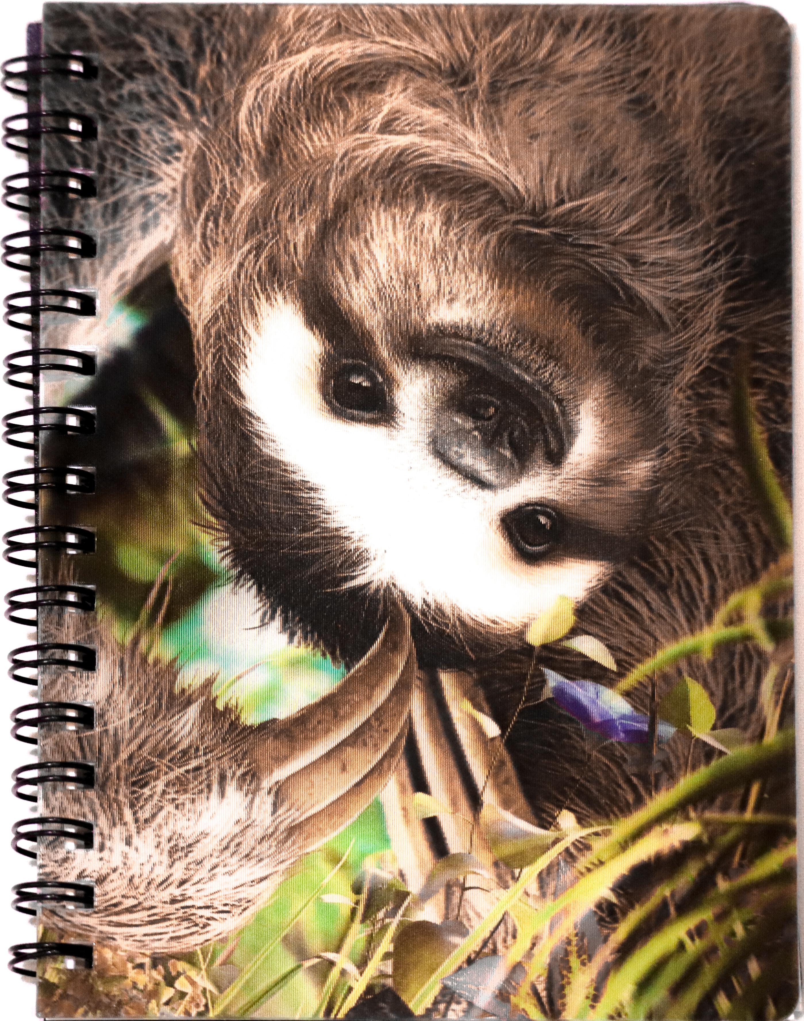 A jotter with a spiral binding and a 3D picture of a sloth