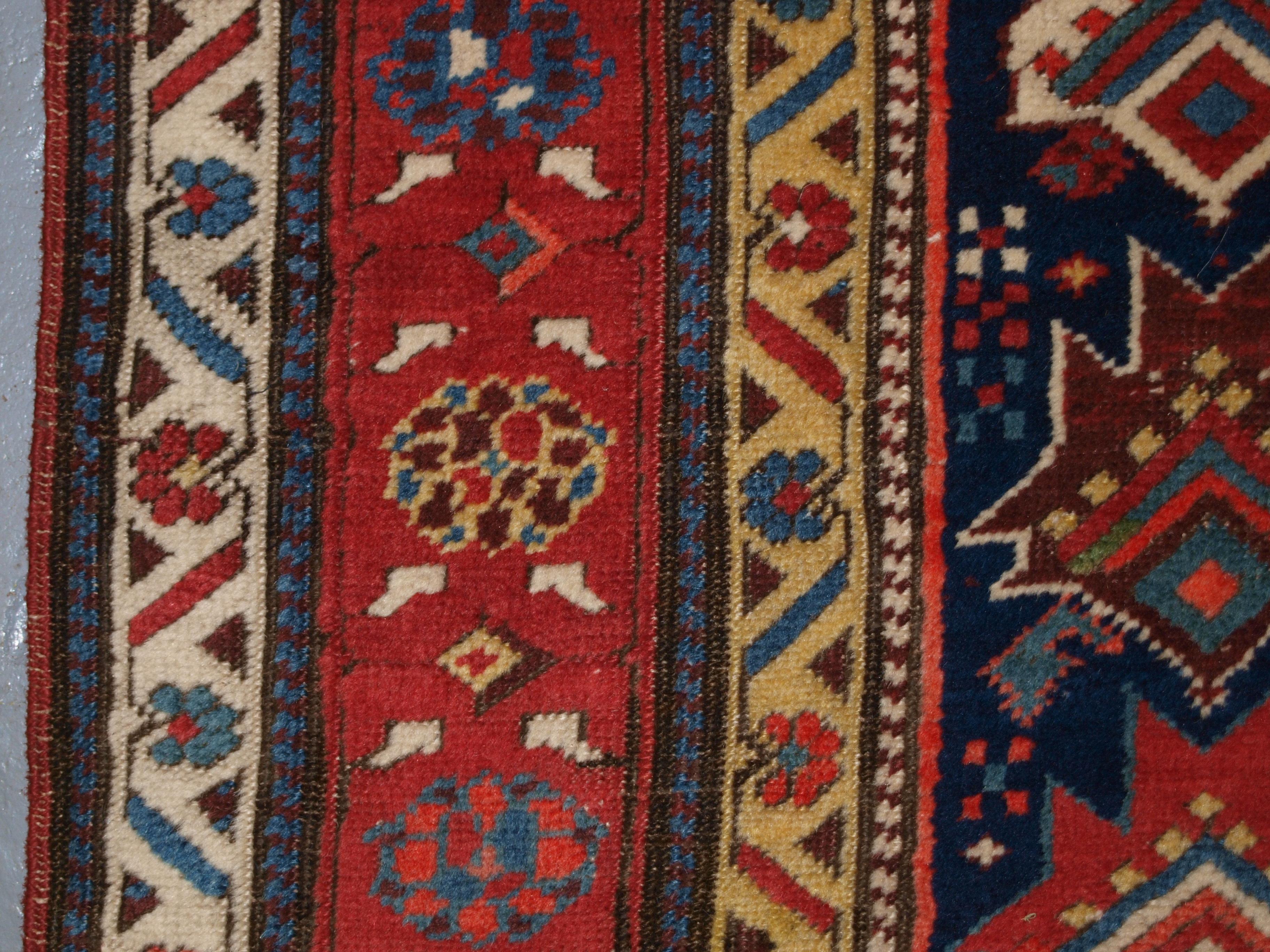 Floral red and yellow border design of antique south caucasian runner