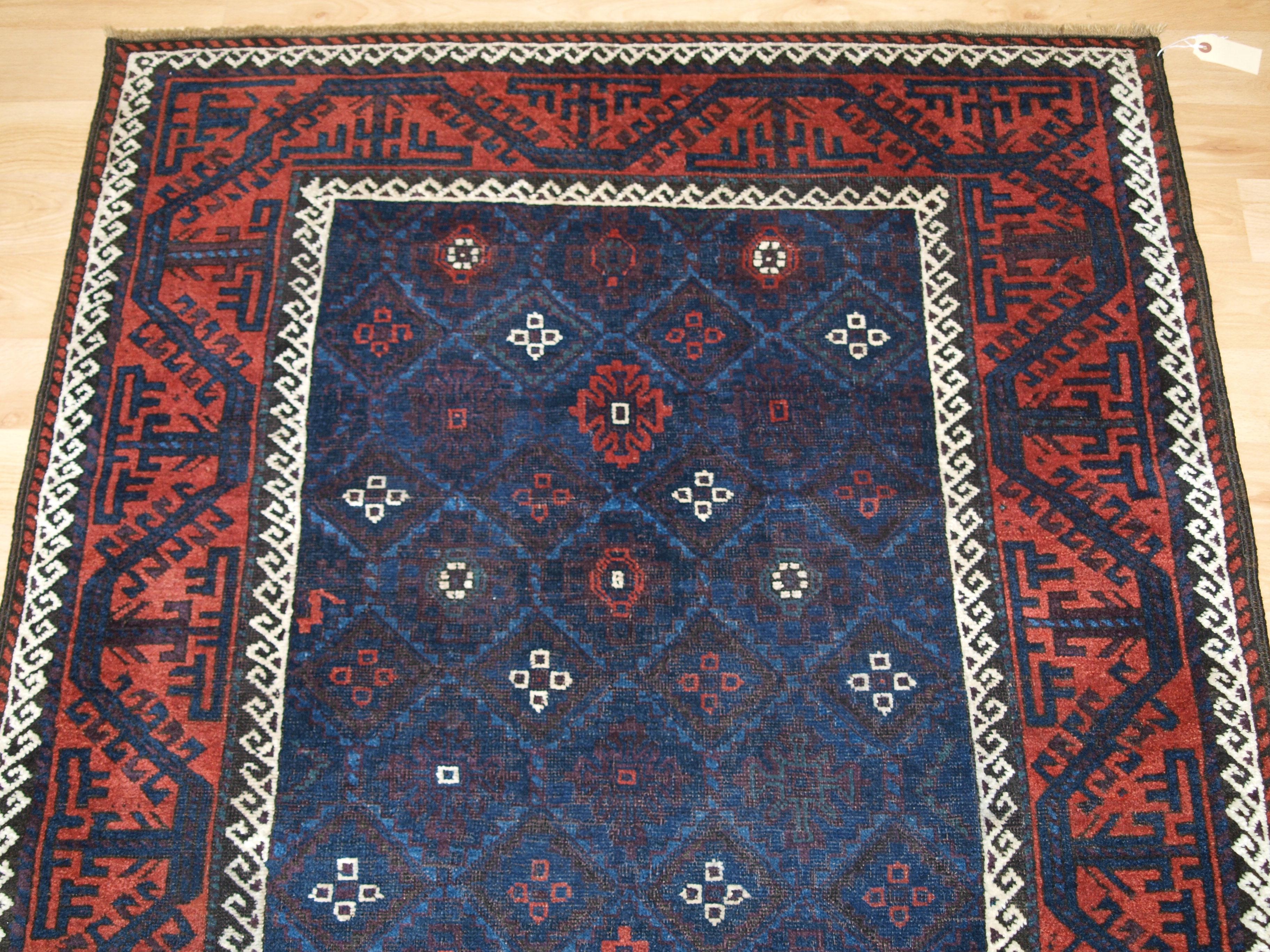Antique Baluch Rug with blue lattice Design and red geometric border