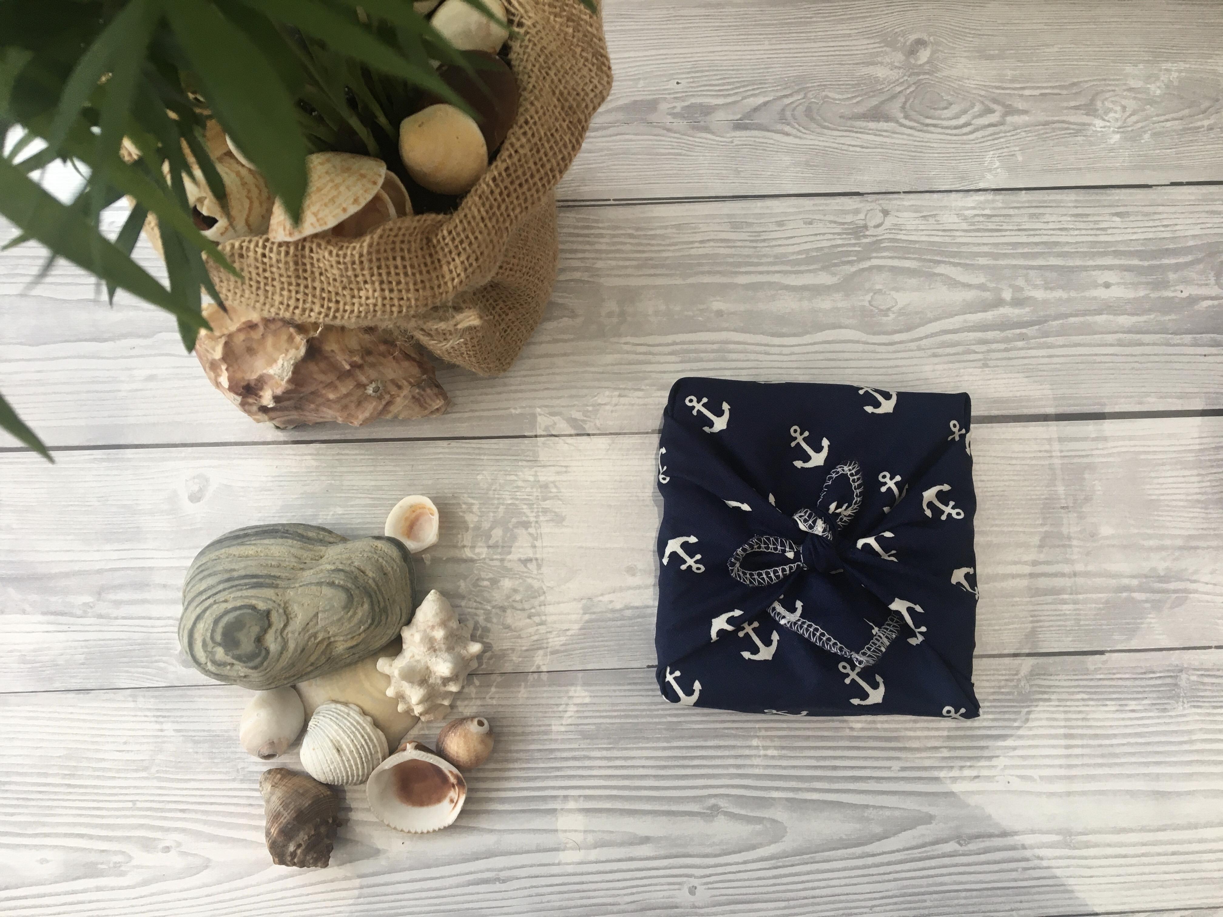 gift wrapped with navy blue and white anchors fabric gift wrap