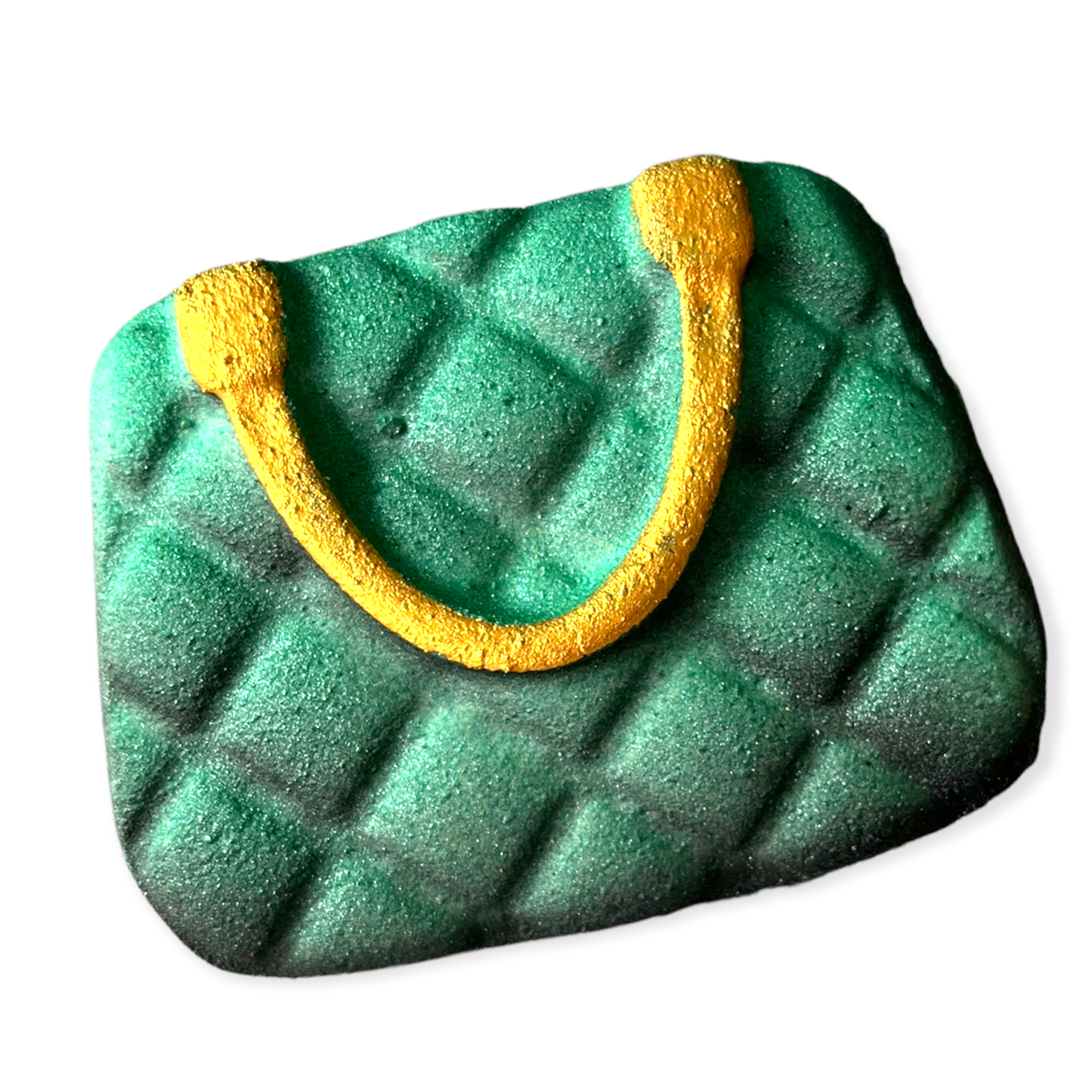 A front view of a Decadent Designer Bath bomb, shaped as a hand bag in the colour of blue and yellow.