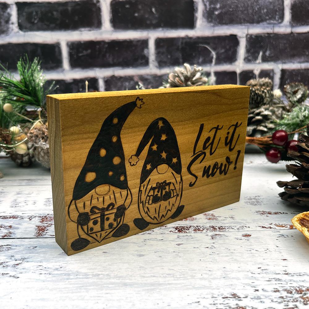 scandi Christmas festive gnomes in hats and text let it snow on wooden block